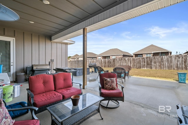 view of patio / terrace featuring an outdoor living space, area for grilling, and fence