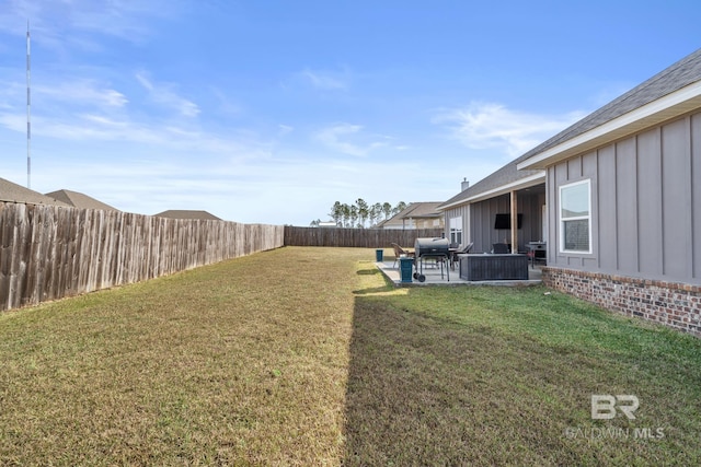 view of yard with a fenced backyard and a patio