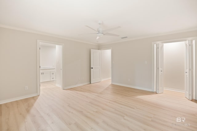 empty room with light hardwood / wood-style flooring, ceiling fan, and crown molding