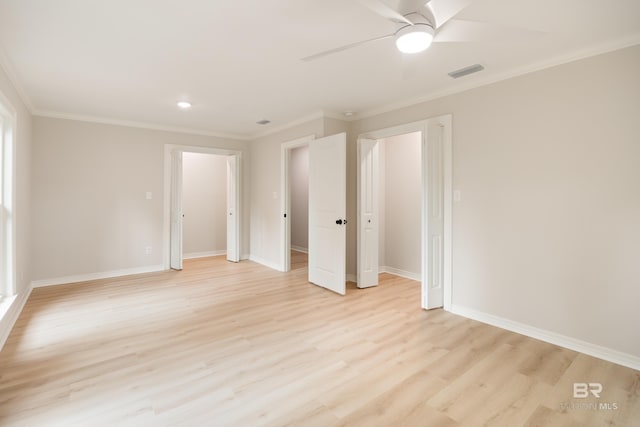 unfurnished bedroom featuring ceiling fan, ornamental molding, and light hardwood / wood-style flooring