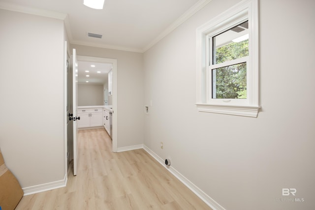 interior space featuring light hardwood / wood-style flooring and ornamental molding