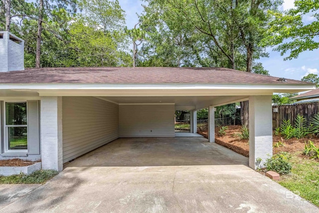 view of parking / parking lot featuring a carport