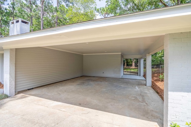 view of vehicle parking with a carport