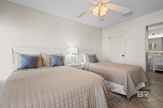 1069 W Beach Blvd Unit 5C, Gulf Shores, AL 36542 - bedroom with tile patterned flooring and a ceiling fan