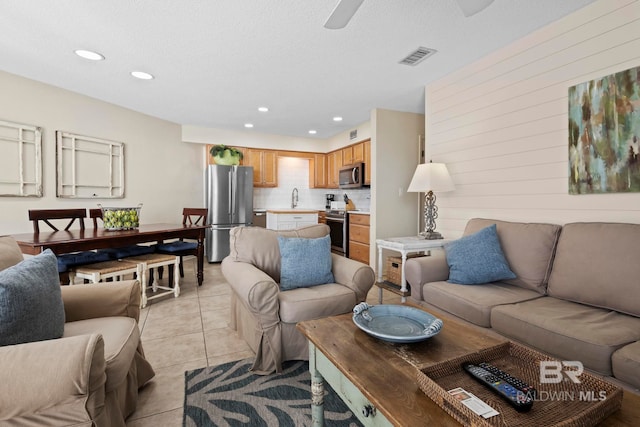 1069 W Beach Blvd Unit 5C, Gulf Shores, AL 36542 - living area with recessed lighting, a ceiling fan, and light tile patterned floors