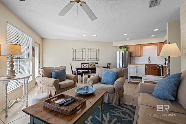 1069 W Beach Blvd Unit 5C, Gulf Shores, AL 36542 - living area with light tile patterned floors, a textured ceiling, recessed lighting, and a ceiling fan