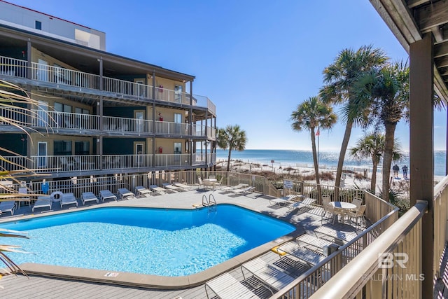 1069 W Beach Blvd Unit 5C, Gulf Shores, AL 36542 - community pool with view of water and beach and a patio area