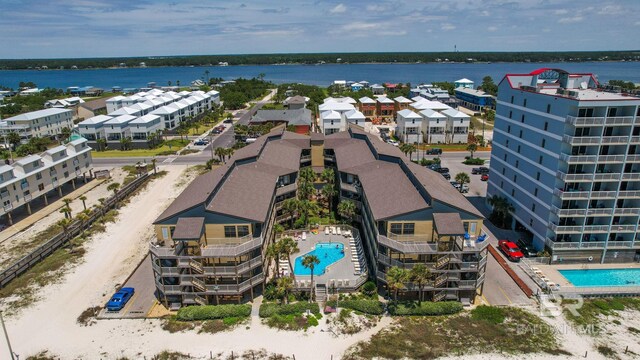 1069 W Beach Blvd Unit 5C, Gulf Shores, AL 36542 - bird's eye view of a pool area and a nearby body of water