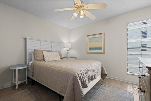 1069 W Beach Blvd Unit 5C, Gulf Shores, AL 36542 - bedroom featuring tile patterned flooring and ceiling fan