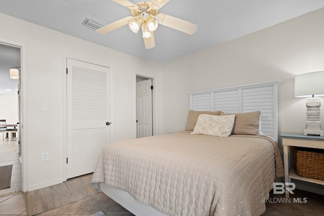1069 W Beach Blvd Unit 5C, Gulf Shores, AL 36542 - bedroom featuring tile patterned flooring, a closet, and ceiling fan