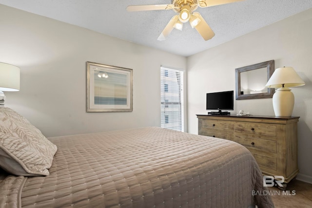 1069 W Beach Blvd Unit 5C, Gulf Shores, AL 36542 - bedroom featuring a textured ceiling and ceiling fan