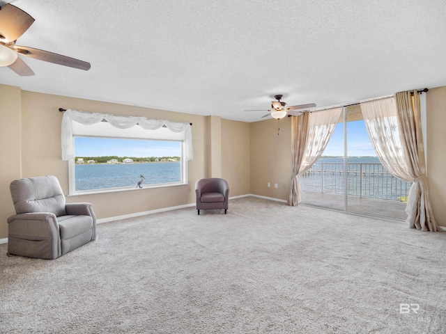 1516 Sandpiper Ln Unit 209, Gulf Shores, AL 36542 - unfurnished room featuring carpet flooring, ceiling fan, a water view, and a textured ceiling