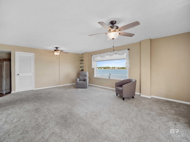 1516 Sandpiper Ln Unit 209, Gulf Shores, AL 36542 - unfurnished room with carpet flooring, ceiling fan, a water view, and a textured ceiling