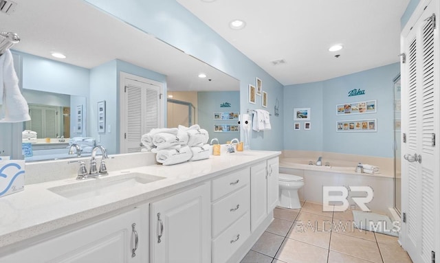 full bathroom featuring vanity, plus walk in shower, toilet, and tile patterned flooring