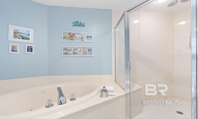 bathroom with shower with separate bathtub