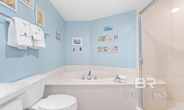 full bathroom featuring vanity, shower with separate bathtub, and toilet