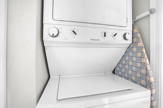 washroom with laundry area and stacked washer and dryer