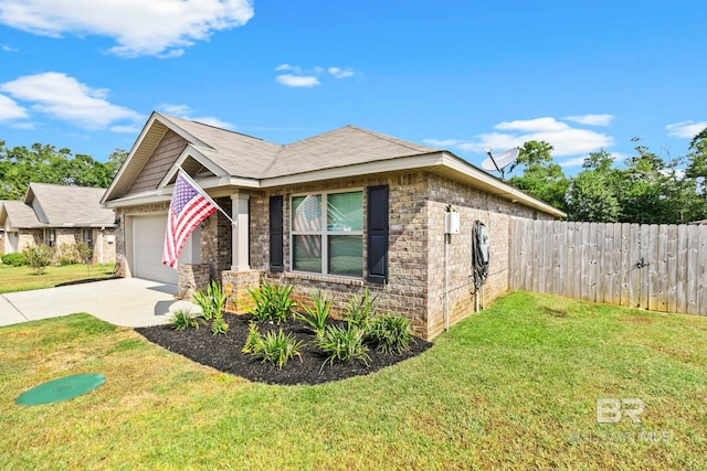 view of front of house with a front yard and a garage