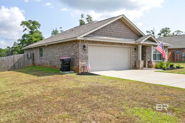 view of front of home with a garage and a front yard