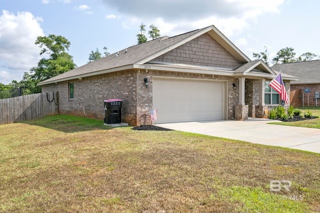 view of front facade with brick siding, fence, a garage, driveway, and a front lawn