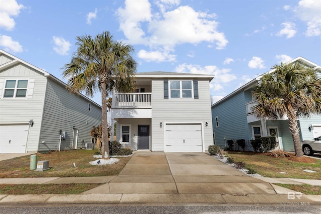 view of front of property with cooling unit, a garage, and a balcony