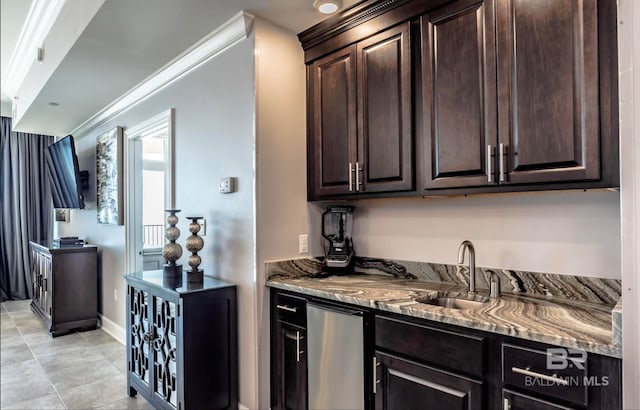 kitchen with light tile flooring, crown molding, dark brown cabinetry, and light stone countertops