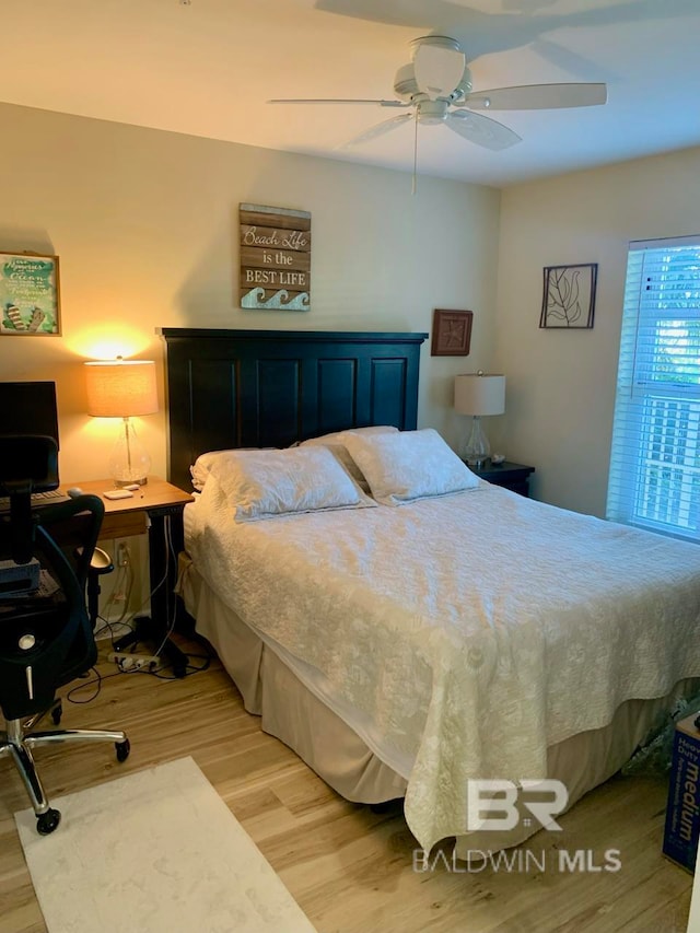 bedroom featuring ceiling fan and light hardwood / wood-style flooring