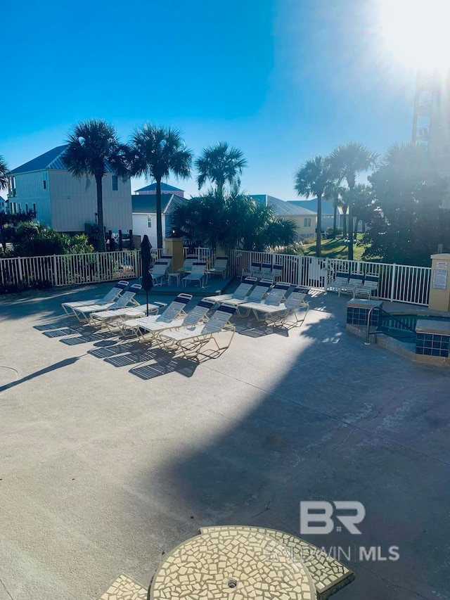 view of swimming pool with a mountain view and a patio area