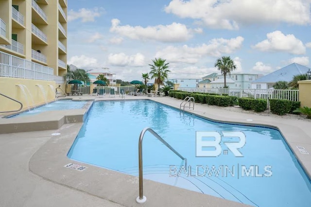 453 Dune Dr Unit 107, Gulf Shores, AL 36542 - community pool featuring fence and a patio area