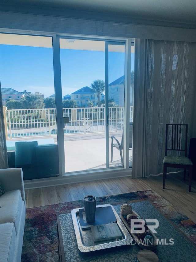 453 Dune Dr Unit 107, Gulf Shores, AL 36542 - living area featuring wood finished floors and plenty of natural light