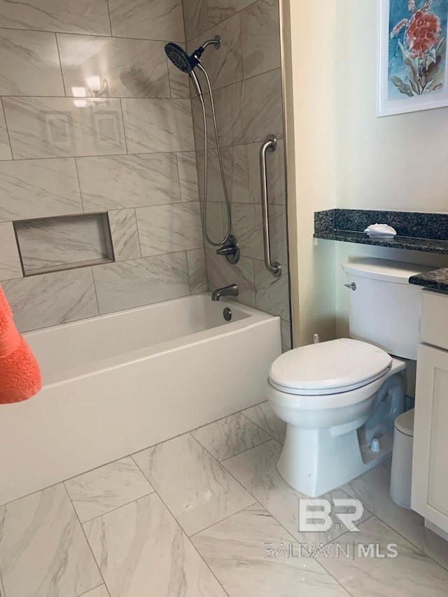 453 Dune Dr Unit 107, Gulf Shores, AL 36542 - full bathroom with toilet, vanity, marble look tiles, and tub / shower combination