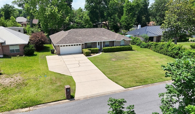 33580 Woodlands Dr, Lillian, AL 36549 - ranch-style house featuring driveway, an attached garage, a front yard, and brick siding