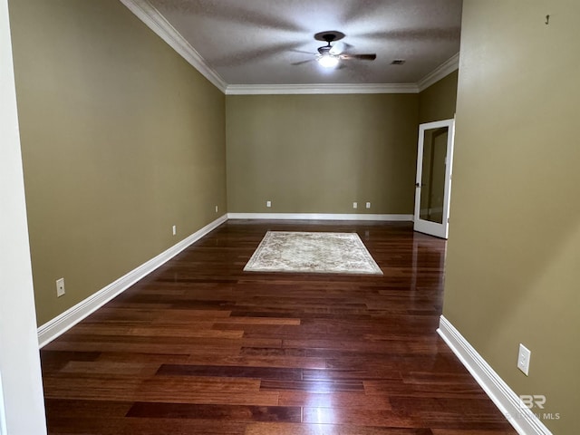 unfurnished room featuring ceiling fan, crown molding, and dark hardwood / wood-style floors