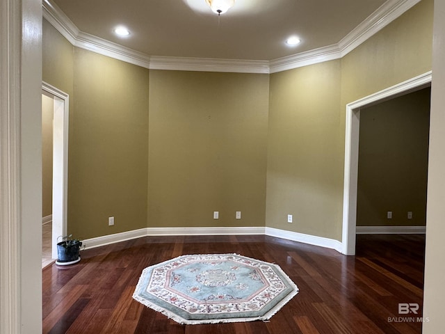 unfurnished room with dark wood-type flooring and ornamental molding