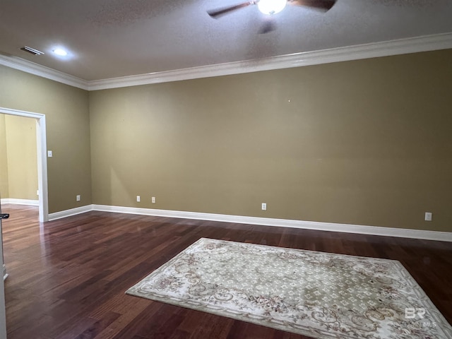 empty room featuring ceiling fan, dark hardwood / wood-style floors, and ornamental molding