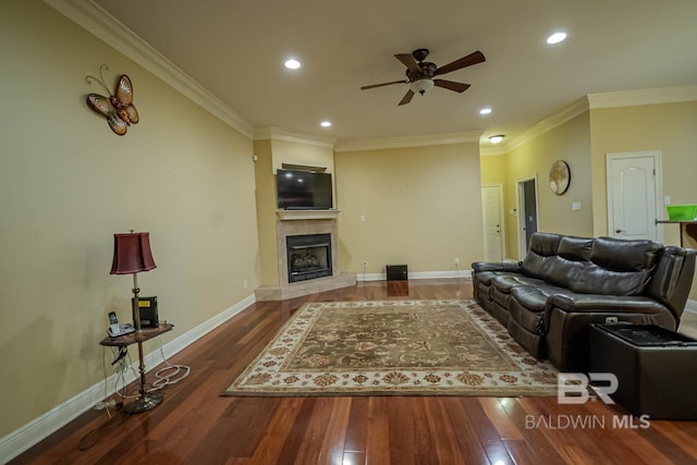 living room featuring ornamental molding, hardwood / wood-style floors, and ceiling fan