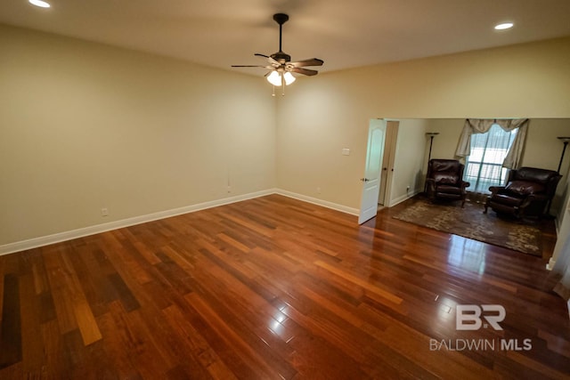 unfurnished room featuring ceiling fan and dark hardwood / wood-style flooring