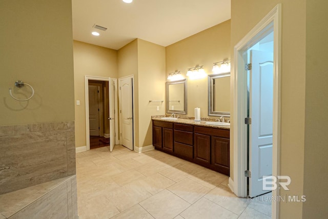 bathroom featuring tile patterned floors and vanity