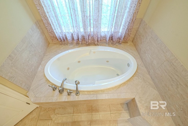 bathroom with tiled tub