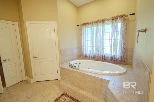 bathroom with tiled bath