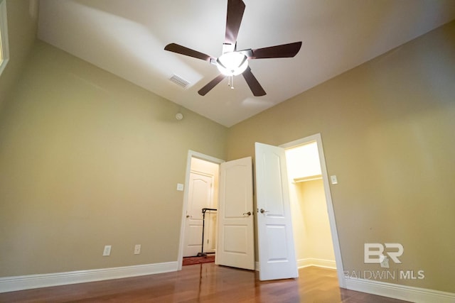 unfurnished bedroom featuring hardwood / wood-style flooring and ceiling fan