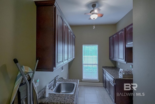 kitchen with sink, light tile patterned flooring, and ceiling fan