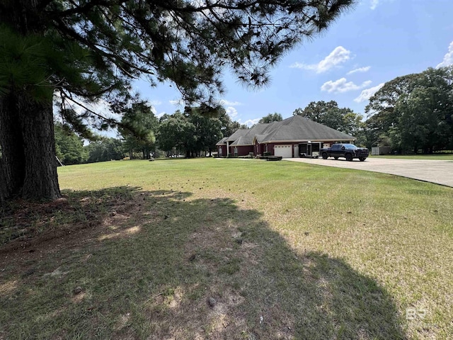 view of yard with a garage