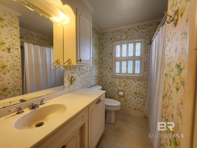 bathroom with walk in shower, crown molding, vanity, and toilet