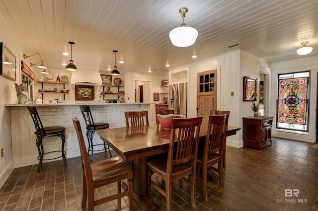 dining space with wooden ceiling, brick floor, visible vents, and recessed lighting