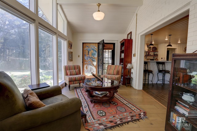 living room with vaulted ceiling and wood finished floors