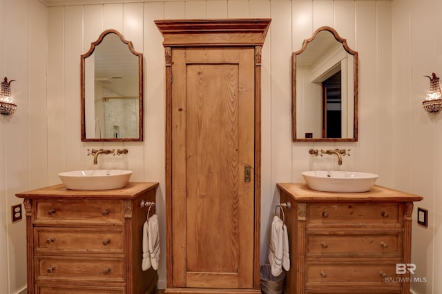 full bath featuring two vanities and a sink