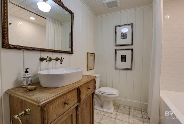 full bath featuring visible vents, vanity, and toilet