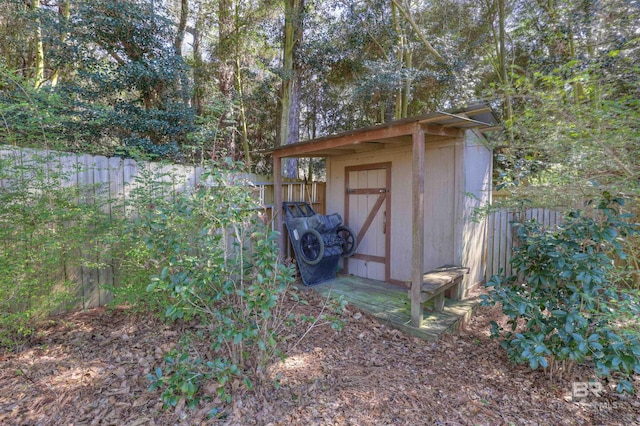 view of shed featuring a fenced backyard