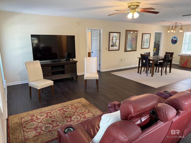 28712 Canal Rd, Orange Beach, AL 36561 - living room featuring baseboards, a ceiling fan, wood finished floors, and a textured ceiling